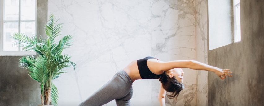 Woman doing yoga stance in the studio