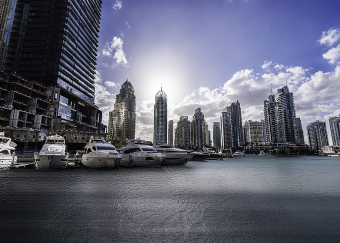 Dubai Marina Yacht Club in front for tall builidngs