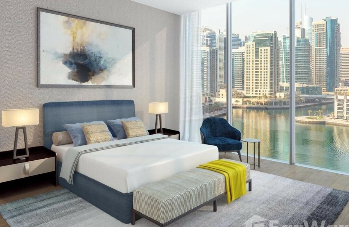 white bedroom overlooking dubai marina